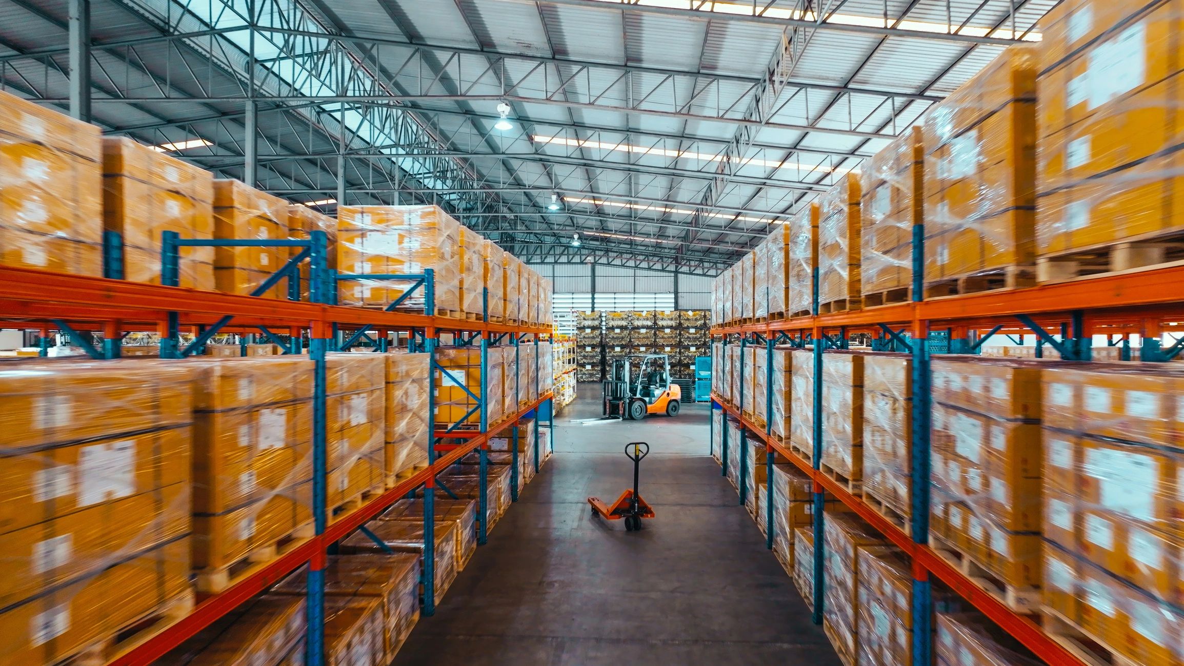 Warehouse shelving and logistics environment representing industrial reader deployments