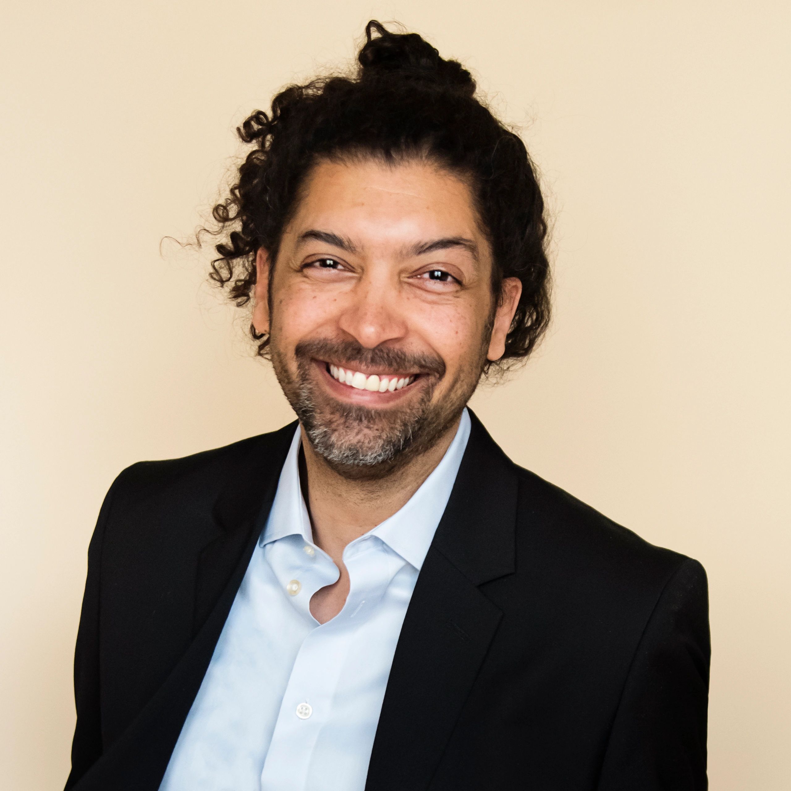 Professional headshot representing systems integration